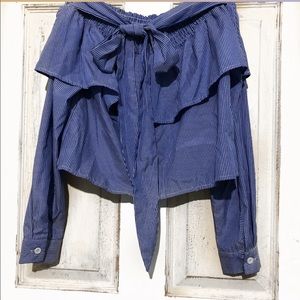 Long sleeve off the shoulder blouse.